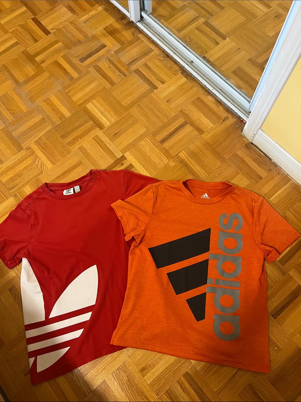 2 adidas kids (10/12) T-shirts - orange with Gray Logo & Red with White Trefoil